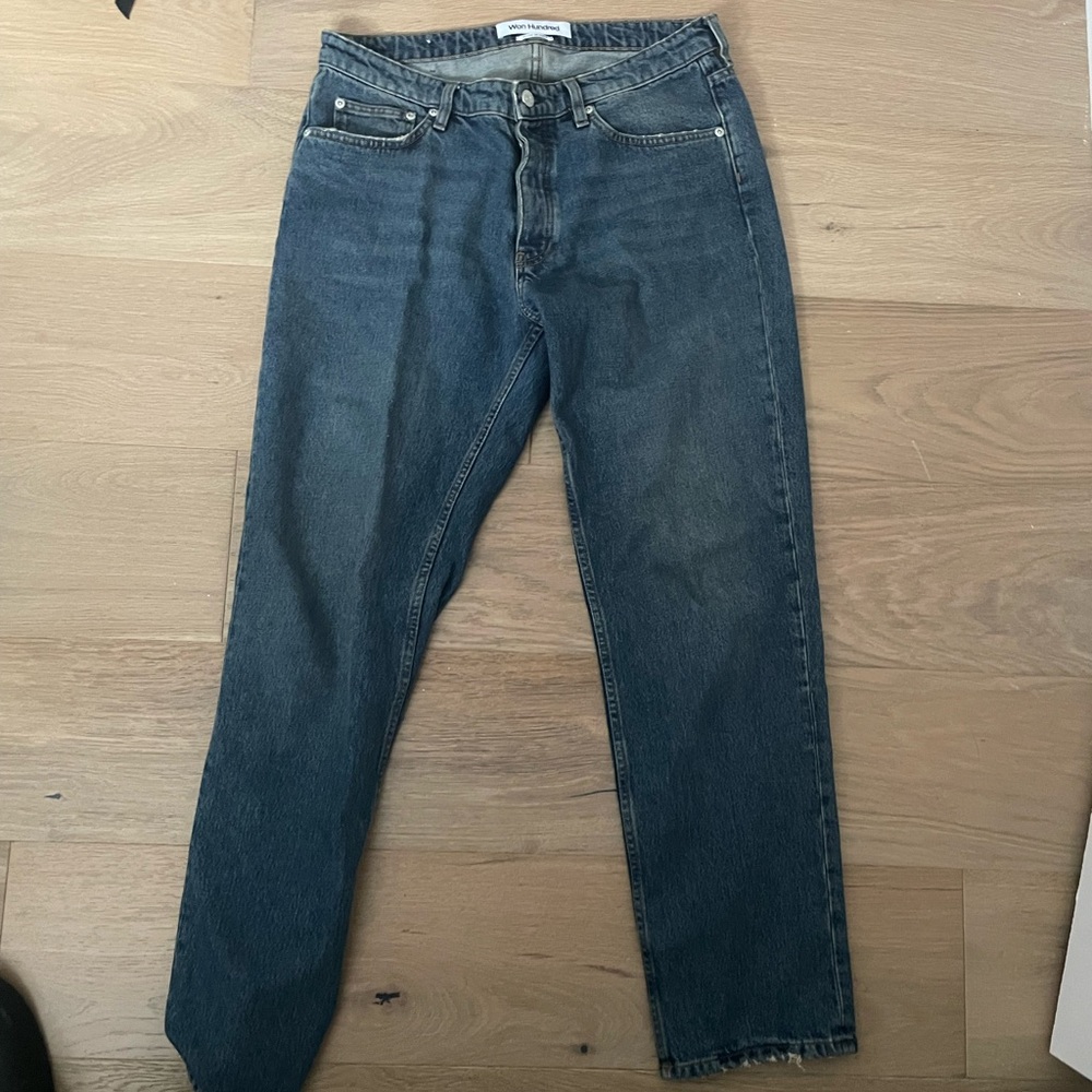 Won hundred washed blue jeans